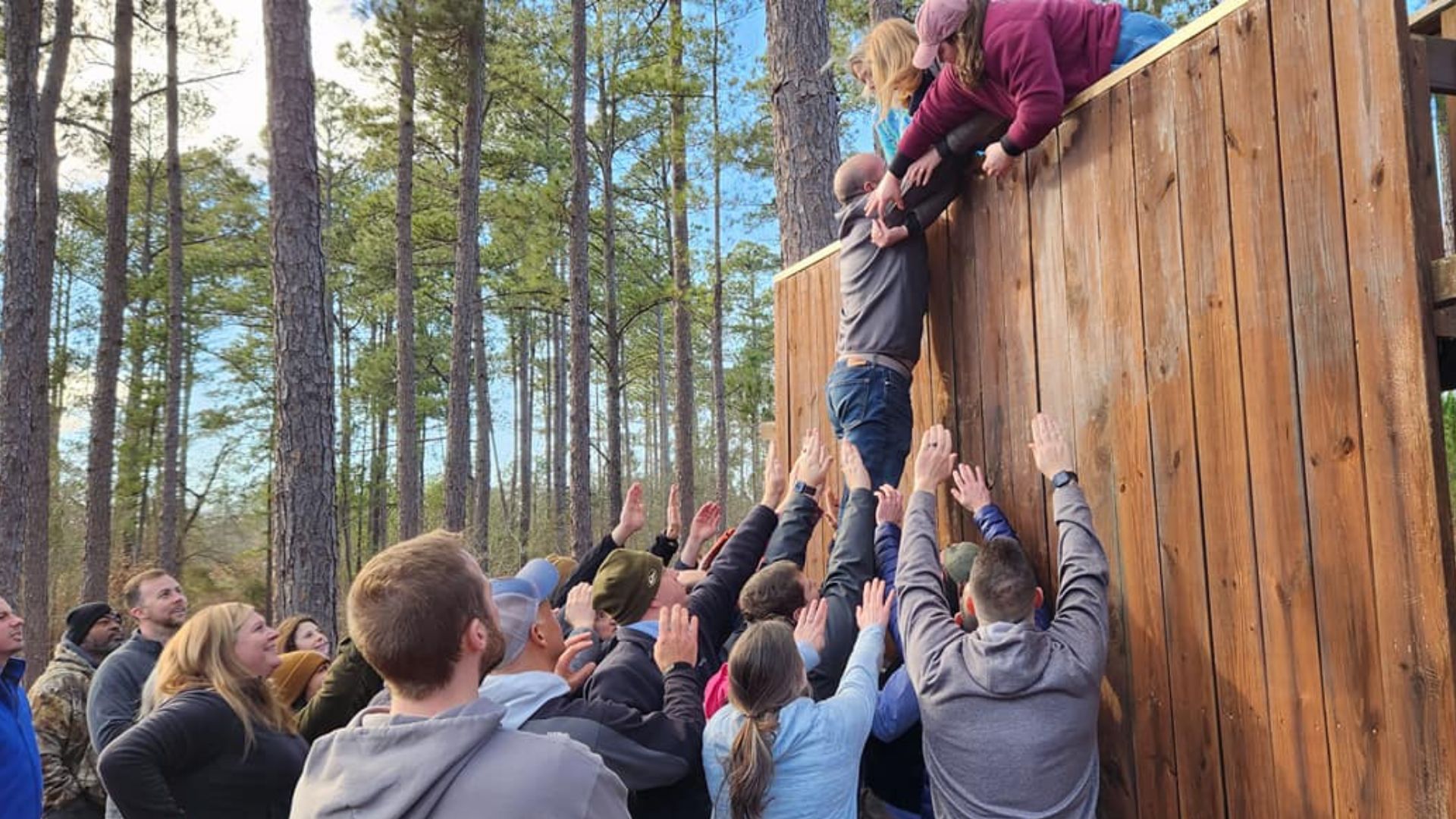 A picture taken by a drone of a youth on the high ropes course at Camp Kinard.